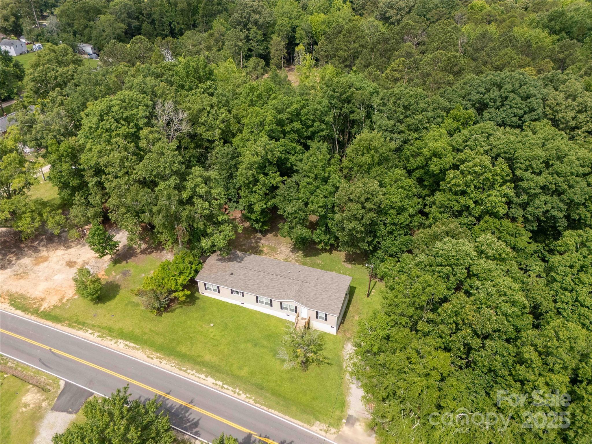 159 Blackmon Road Lancaster, SC 29720 - Photo 29 of 32 a view of a yard with a tree
