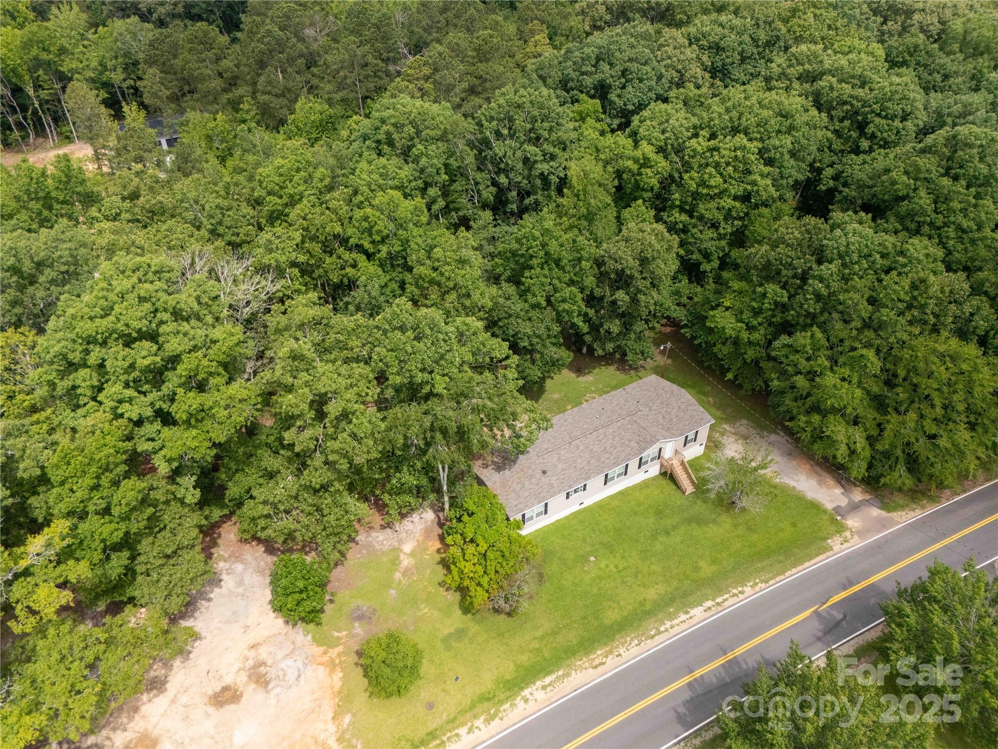 159 Blackmon Road Lancaster, SC 29720 - Photo 31 of 32 a view of a yard with potted plants