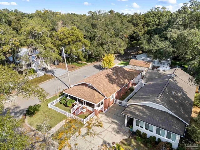 an aerial view of ocean and residential houses with outdoor space and lake view