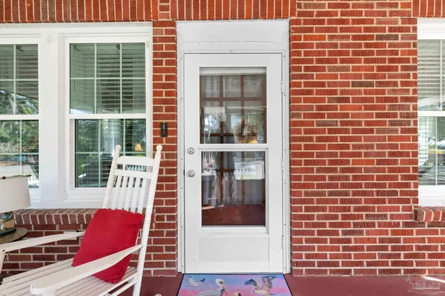 a red brick building with glass windows