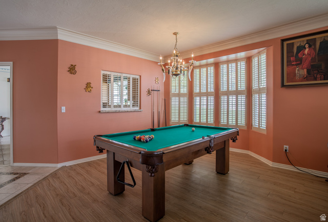 5302 South Birch Pt Road Murray, UT 84117 - Photo 14 of 29 Wood-finish flooring, crown molding, and a bay window featuring plantation shutters
