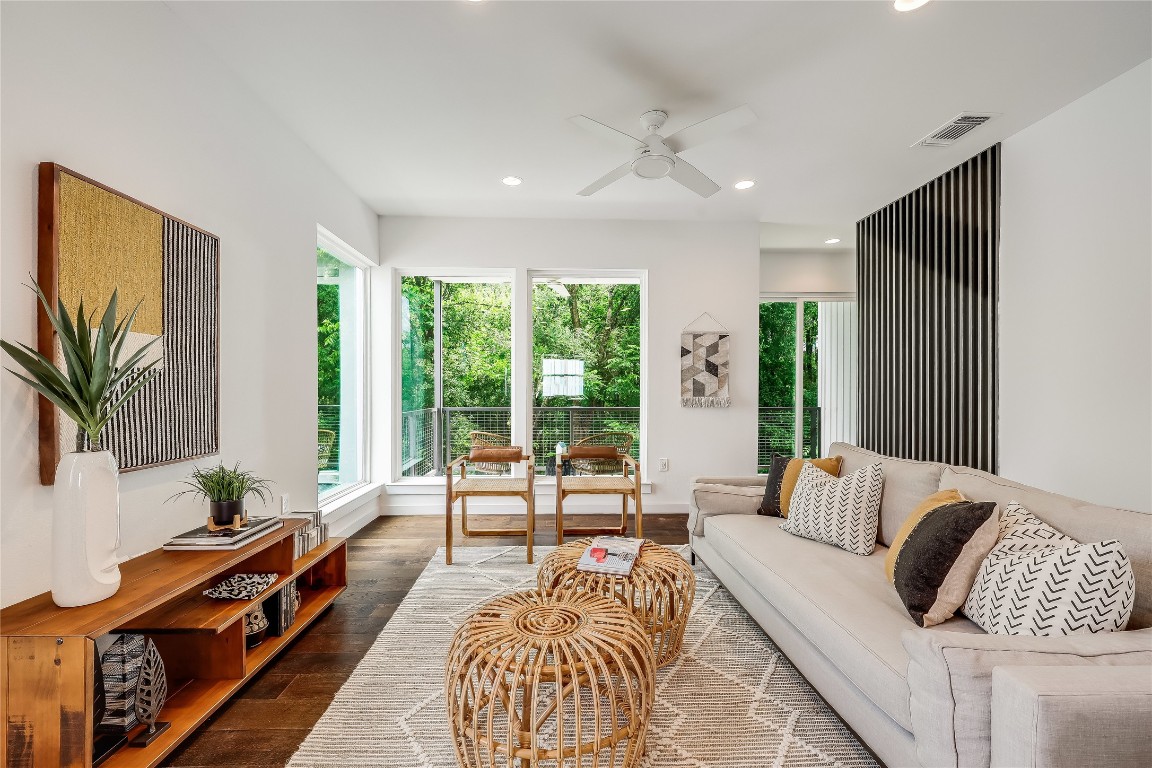 a living room with furniture and a large window