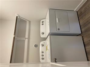 6022 Eagle Ridge Drive Bryan, TX 77807 - Photo 8 of 11 a utility room with dryer and washer