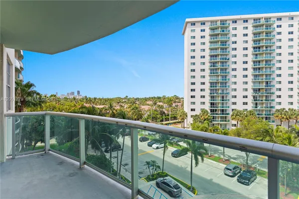a view of balcony with furniture