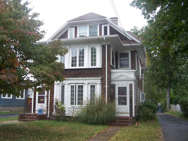 314 Stratfield Road Fairfield, CT 06825 - Photo 1 of 1 a front view of a house with a yard and trees