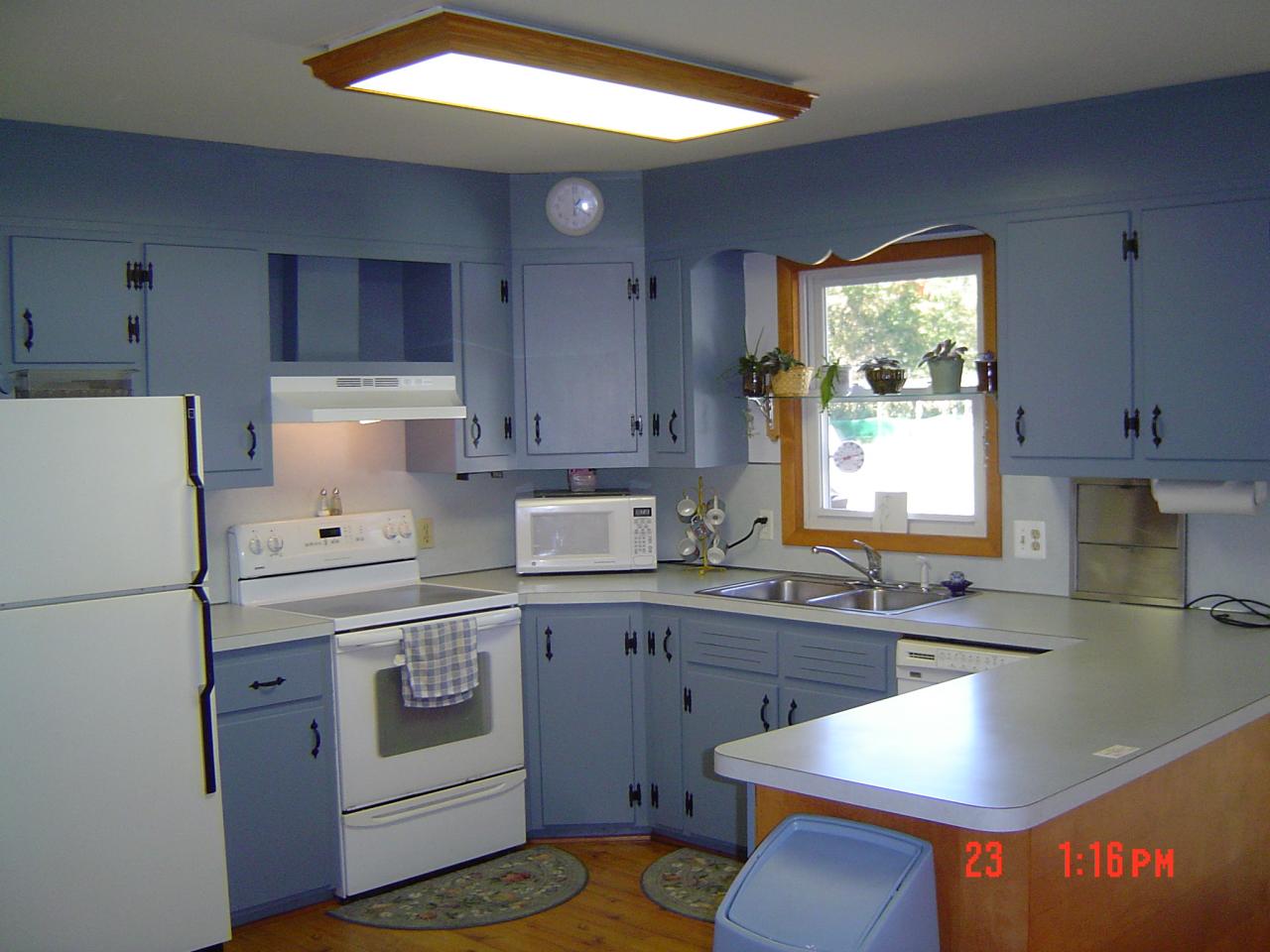 4289 Bossardsville Road Stroudsburg, PA 18360 - Photo 5 of 7 a kitchen with a stove a sink and a refrigerator