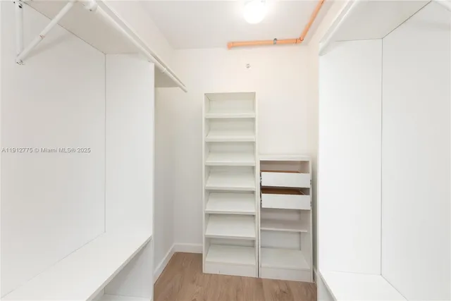 a kitchen with stainless steel appliances granite countertop a sink and a stove