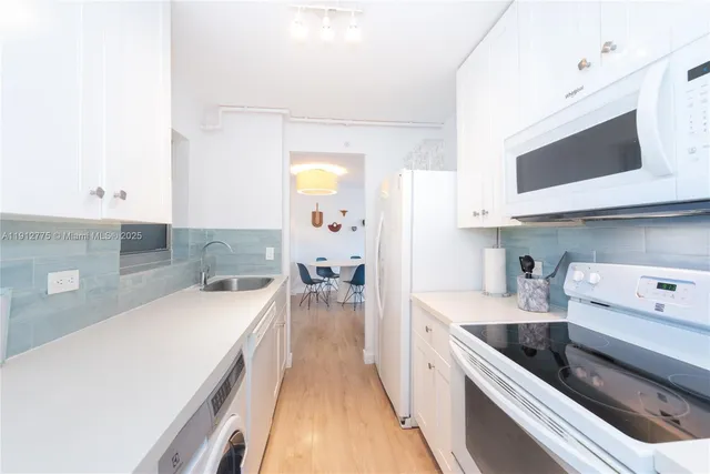 a large bedroom with a bed and a large window