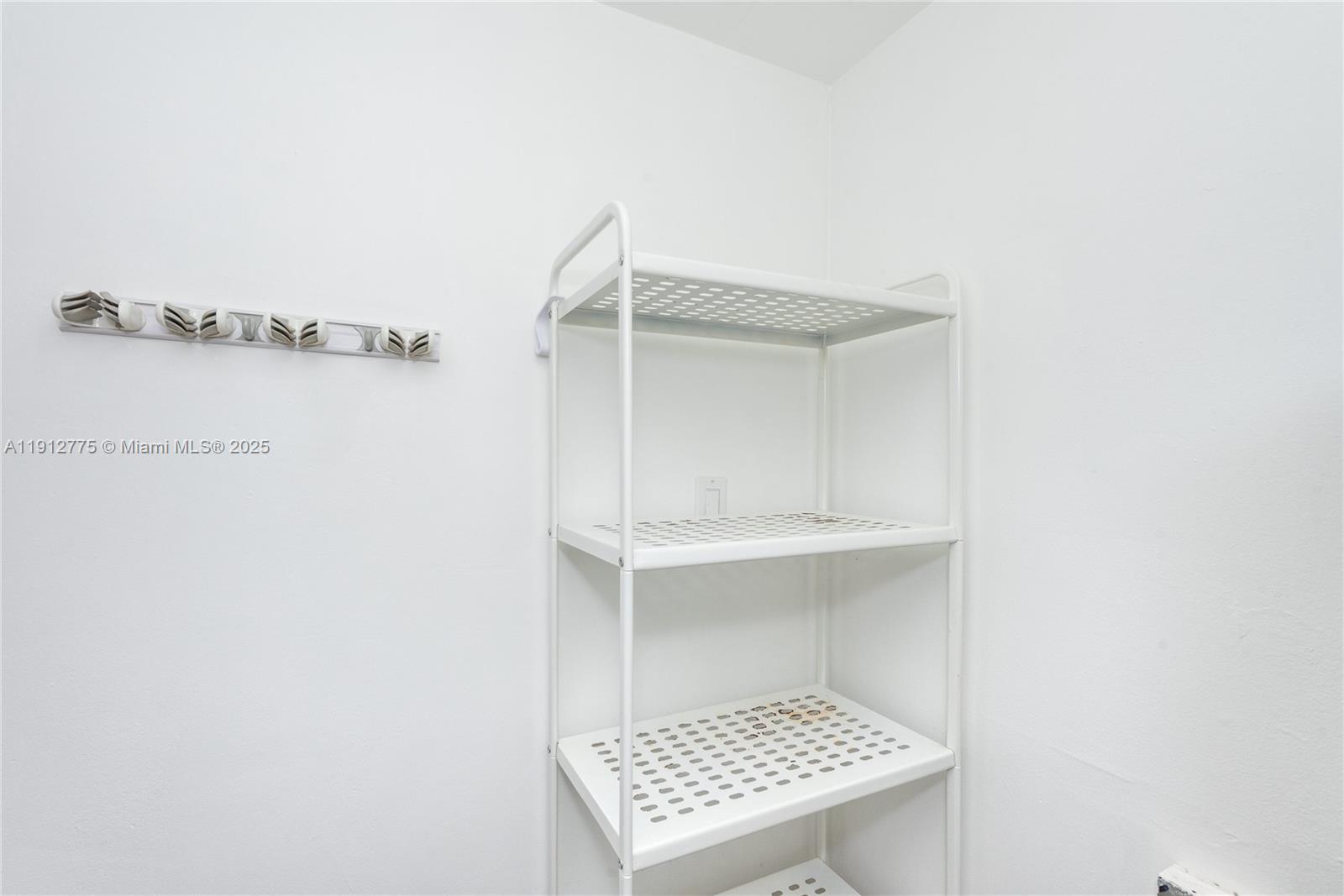 1881 Washington Avenue, Unit 3D Miami Beach, FL 33139 - Photo 23 of 30 a white cabinet in a white room