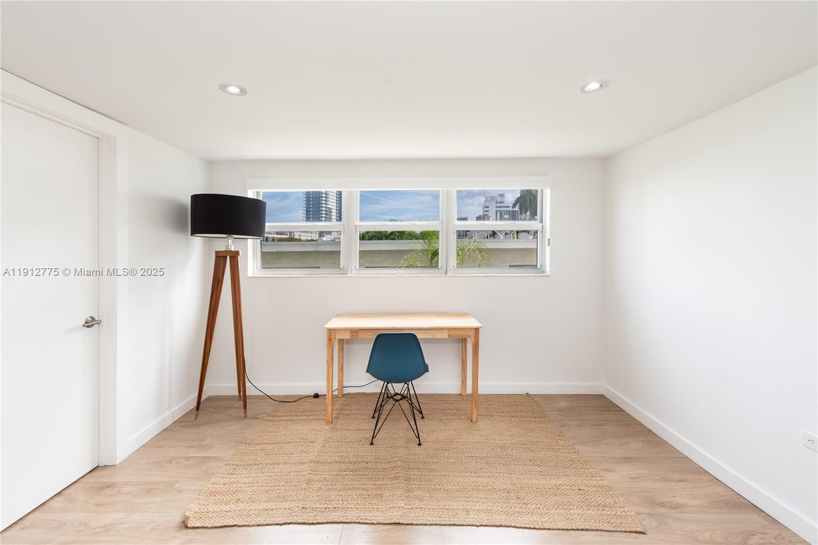 1881 Washington Avenue, Unit 3D Miami Beach, FL 33139 - Photo 6 of 30 a living room with furniture and a potted plant