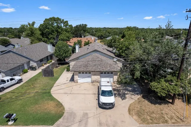 a aerial view of a house with roof deck and couches