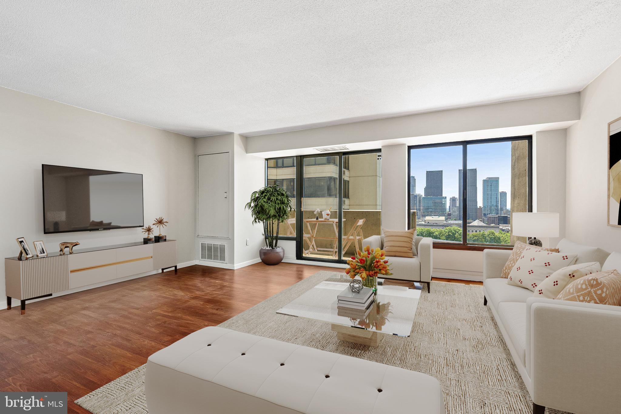a living room with furniture and a flat screen tv