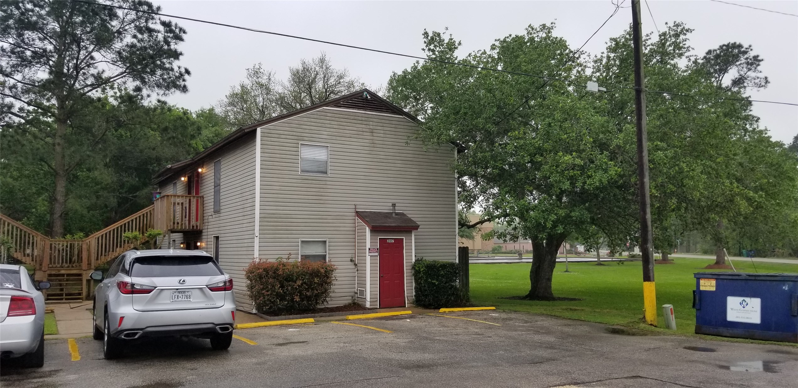 2017 West Sidnor Street, Unit 4 Alvin, TX 77511 - Photo 3 of 13 a view of a car park in front of house