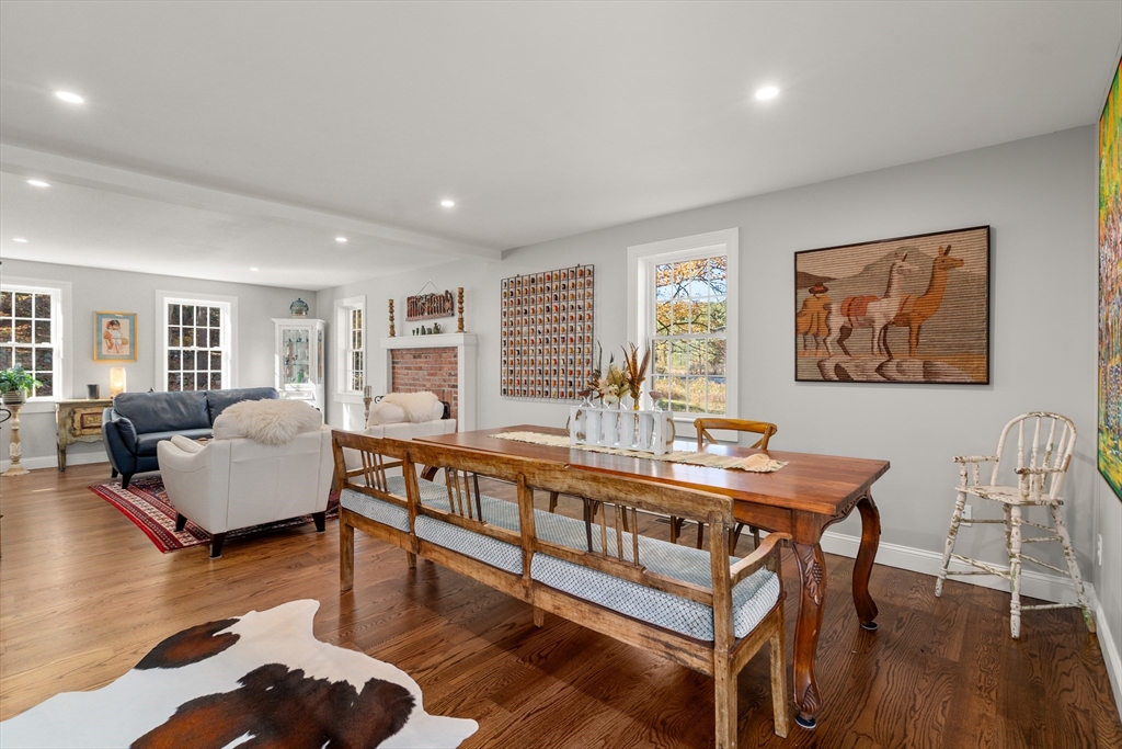 28 Allen Road Sturbridge, MA 01566 - Photo 13 of 33 a living room with furniture a wooden floor and next to a window