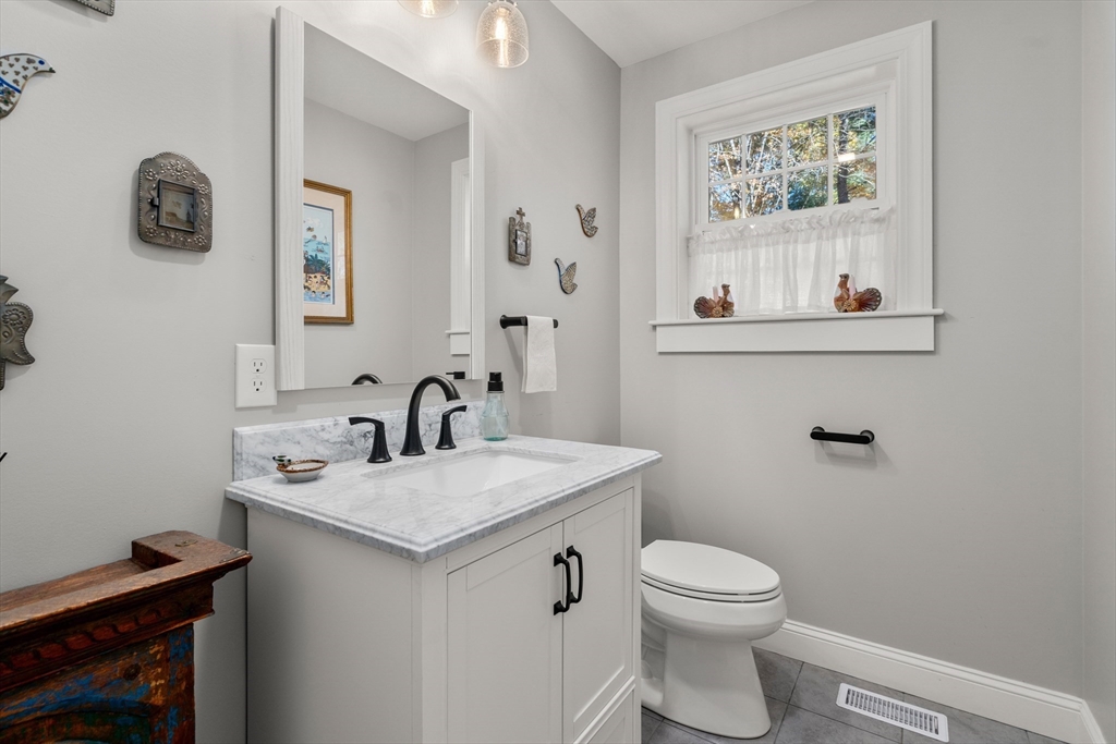 28 Allen Road Sturbridge, MA 01566 - Photo 16 of 33 a bathroom with a toilet a sink and a window
