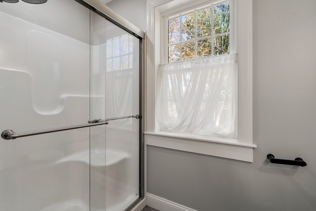 28 Allen Road Sturbridge, MA 01566 - Photo 20 of 33 a bathroom with a glass shower door