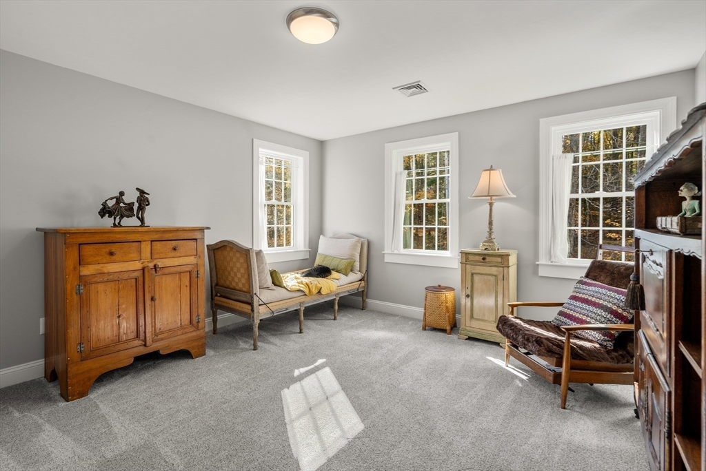 28 Allen Road Sturbridge, MA 01566 - Photo 21 of 33 a living room with furniture and a window