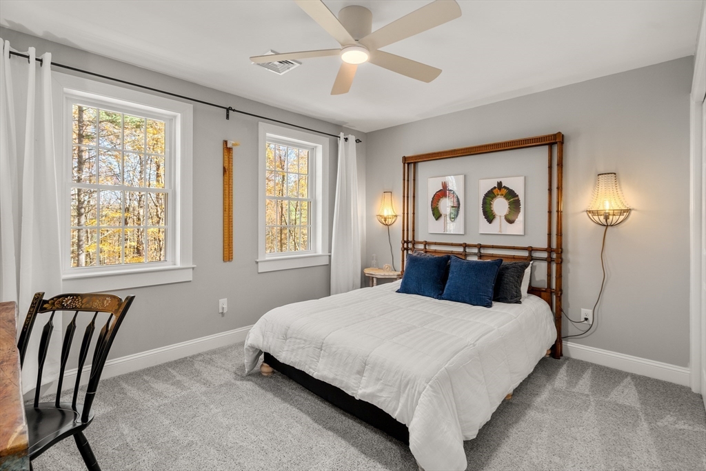 28 Allen Road Sturbridge, MA 01566 - Photo 22 of 33 a bedroom with a bed and a painting on the wall