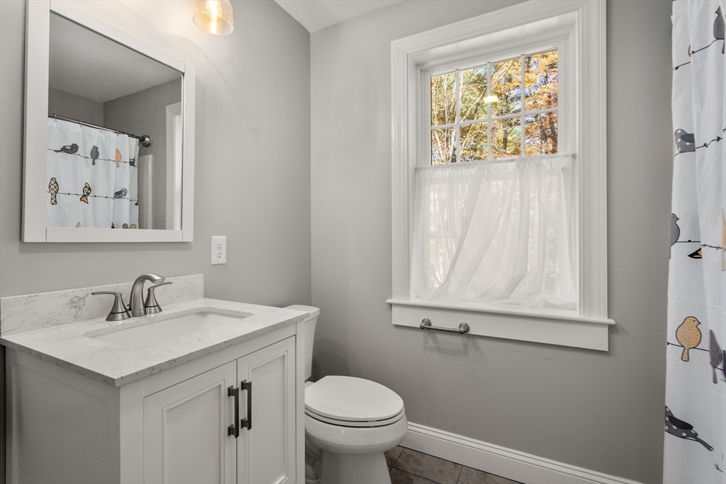 28 Allen Road Sturbridge, MA 01566 - Photo 24 of 33 a bathroom with a toilet sink and mirror