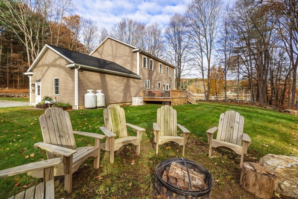 28 Allen Road Sturbridge, MA 01566 - Photo 27 of 33 a view of a house with backyard porch and sitting area