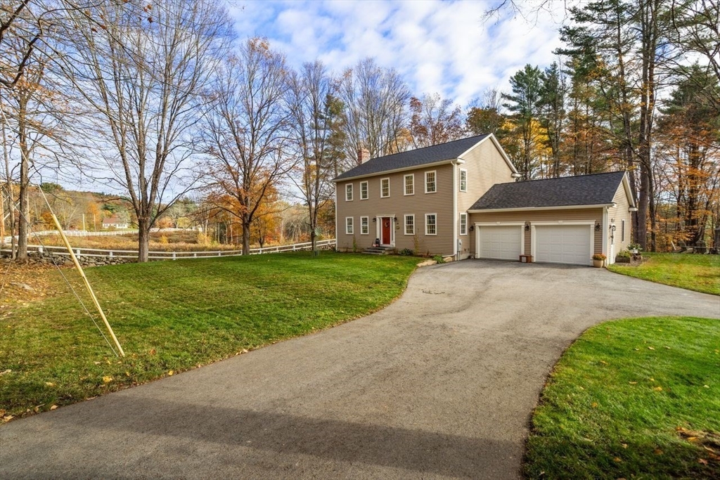 28 Allen Road Sturbridge, MA 01566 - Photo 31 of 33 a front view of a house with a yard and trees