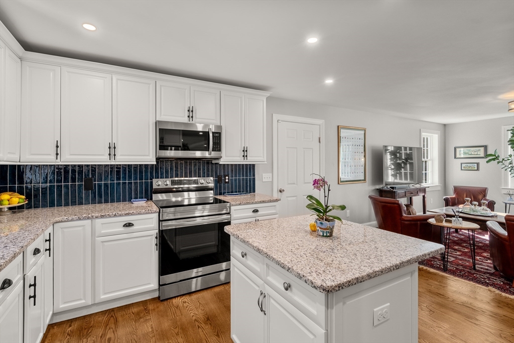 28 Allen Road Sturbridge, MA 01566 - Photo 7 of 33 a kitchen with granite countertop white cabinets and stainless steel appliances