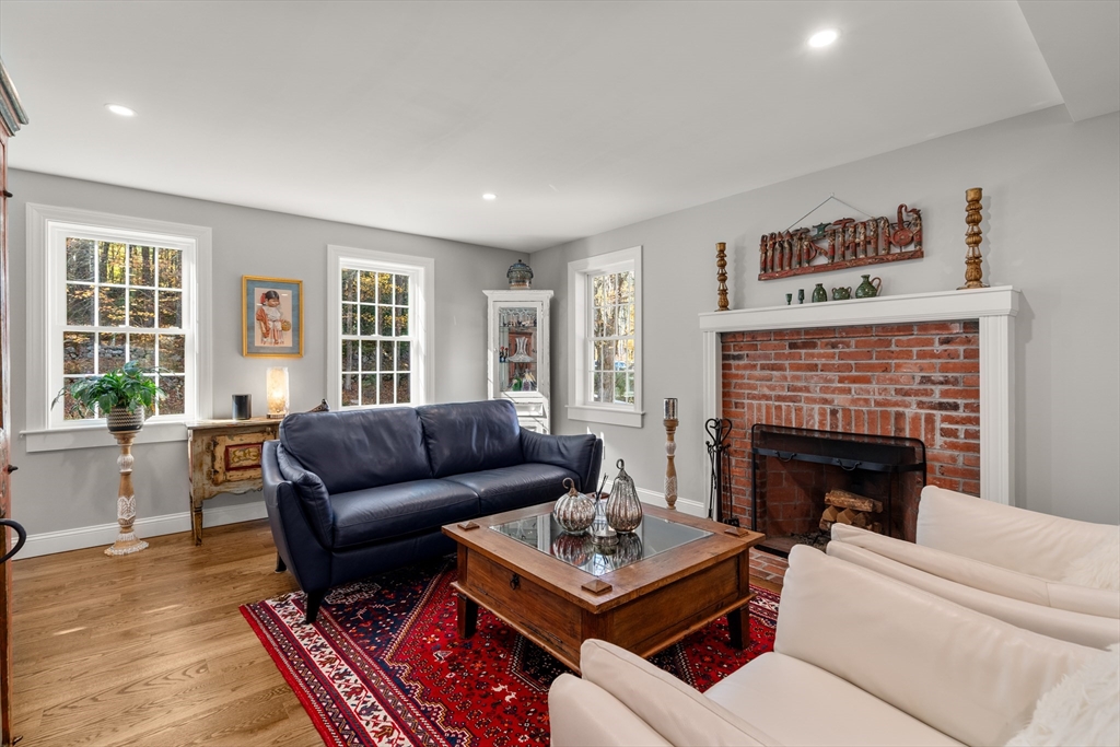 28 Allen Road Sturbridge, MA 01566 - Photo 9 of 33 a living room with furniture and a fireplace