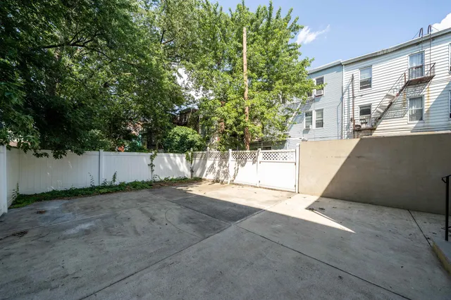 a view of backyard and tree