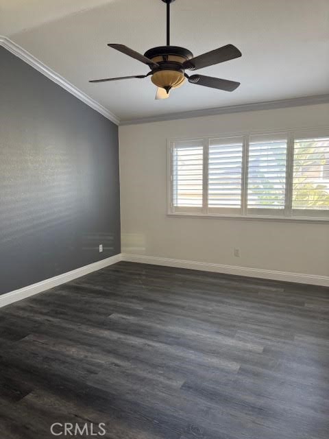 539 South Cinnamon Way Orange, CA 92866 - Photo 9 of 18 an empty room with wooden floor ceiling fan and windows
