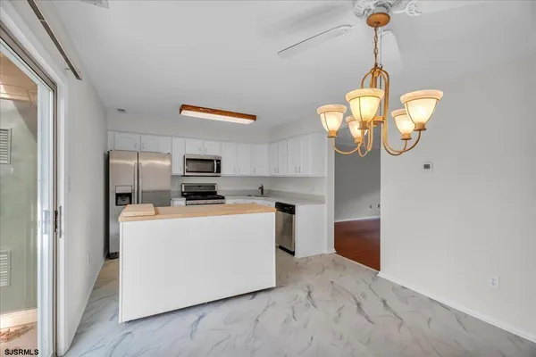 a view of kitchen and microwave