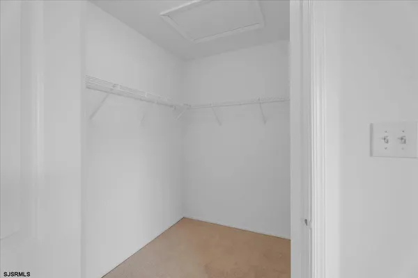 a small space with a white marble wall
