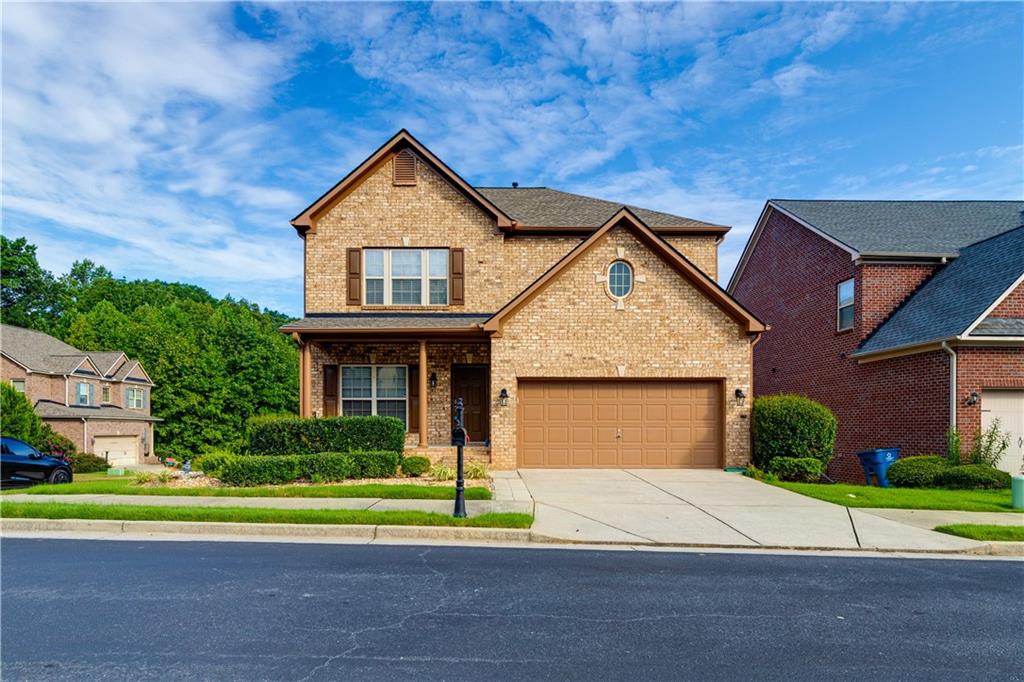 2425 Delamore Chase Duluth, GA 30097 - Photo 1 of 1 a front view of a house with a yard and garage