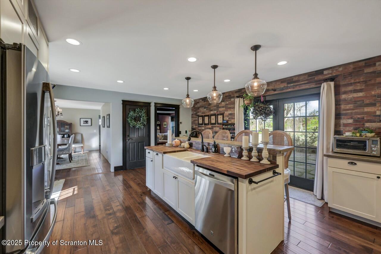 2225 Cherry Hill Road Clarks Summit, PA 18411 - Photo 15 of 81 a open kitchen with stainless steel appliances granite countertop a lot of counter space and wooden floors