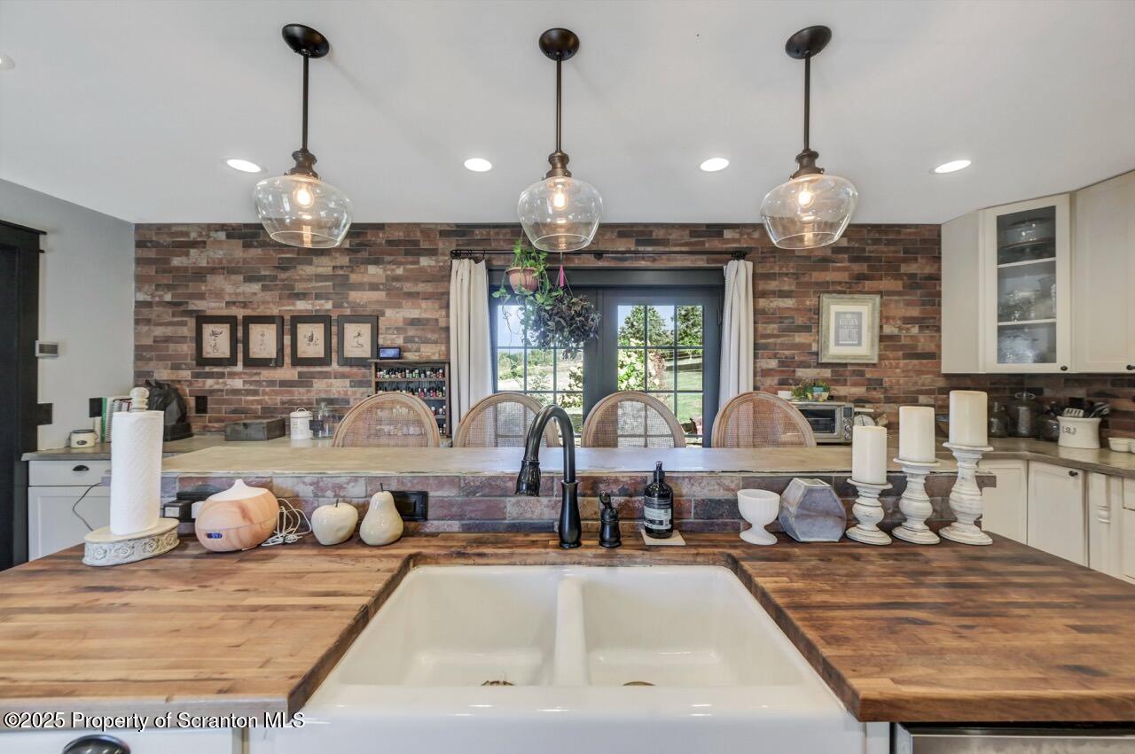 2225 Cherry Hill Road Clarks Summit, PA 18411 - Photo 16 of 81 a view of a dining room and livingroom with furniture wooden floor kitchen chandelier