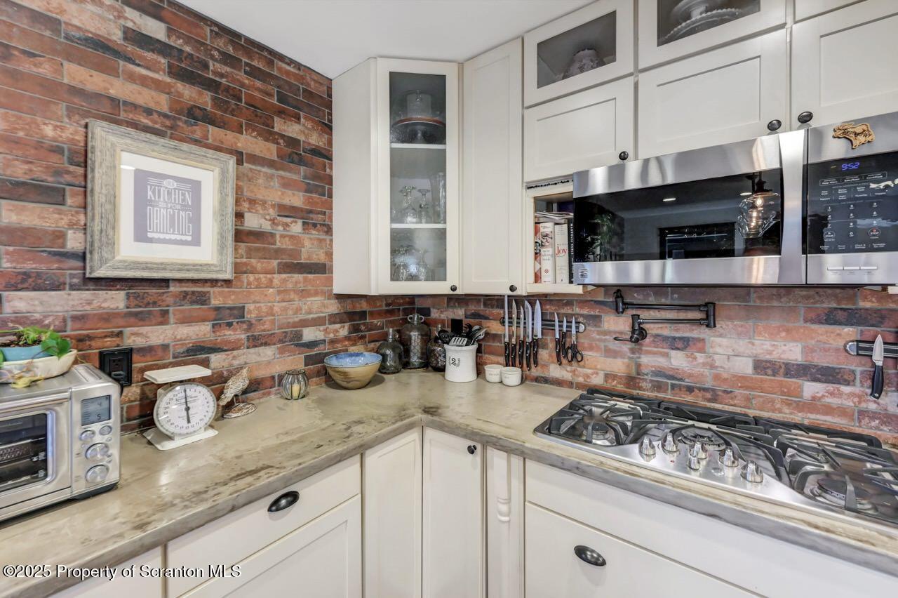 2225 Cherry Hill Road Clarks Summit, PA 18411 - Photo 18 of 81 a kitchen with stainless steel appliances granite countertop a sink a stove and a microwave