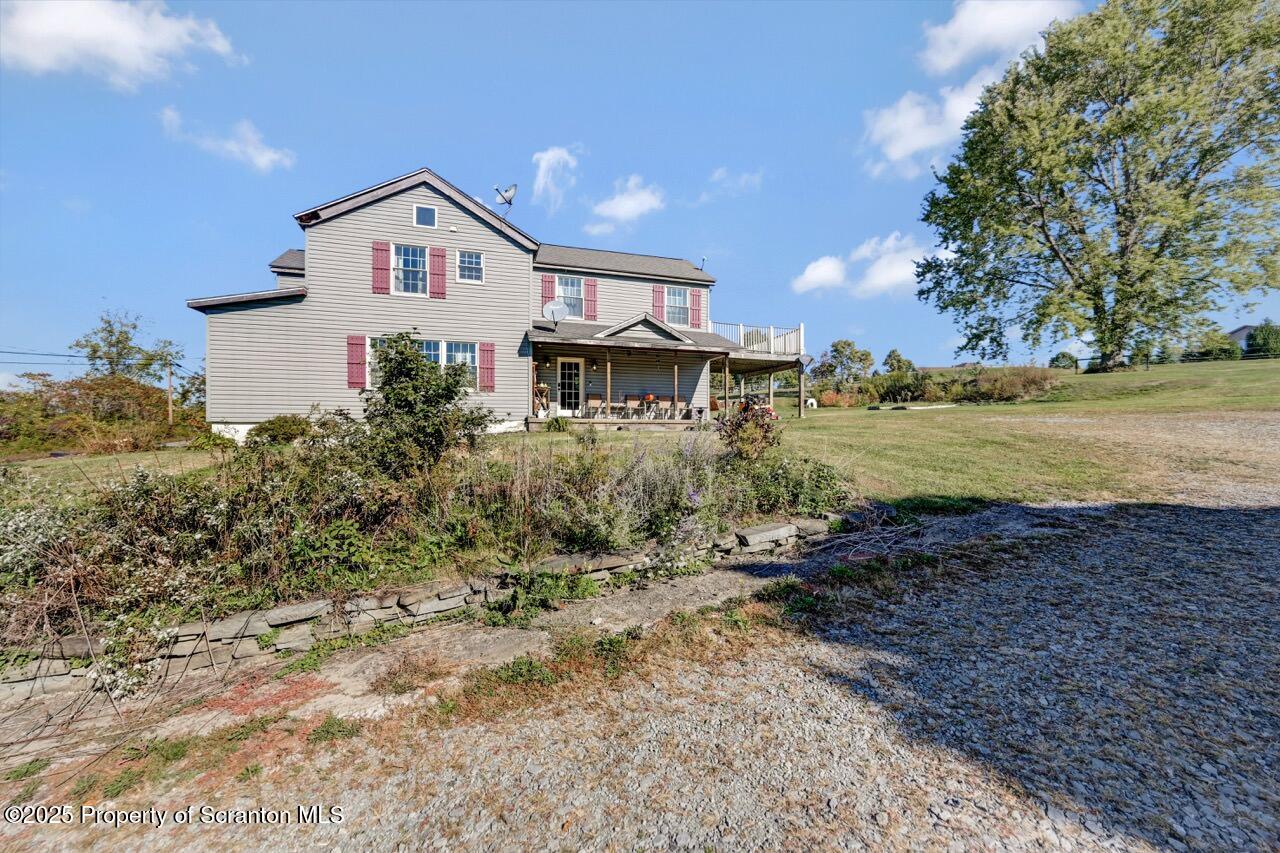 2225 Cherry Hill Road Clarks Summit, PA 18411 - Photo 2 of 81 a front view of a house with a yard and lake view
