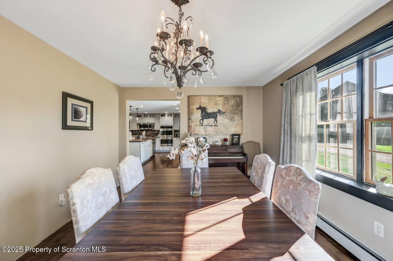 2225 Cherry Hill Road Clarks Summit, PA 18411 - Photo 23 of 81 a living room with fireplace furniture and a large window