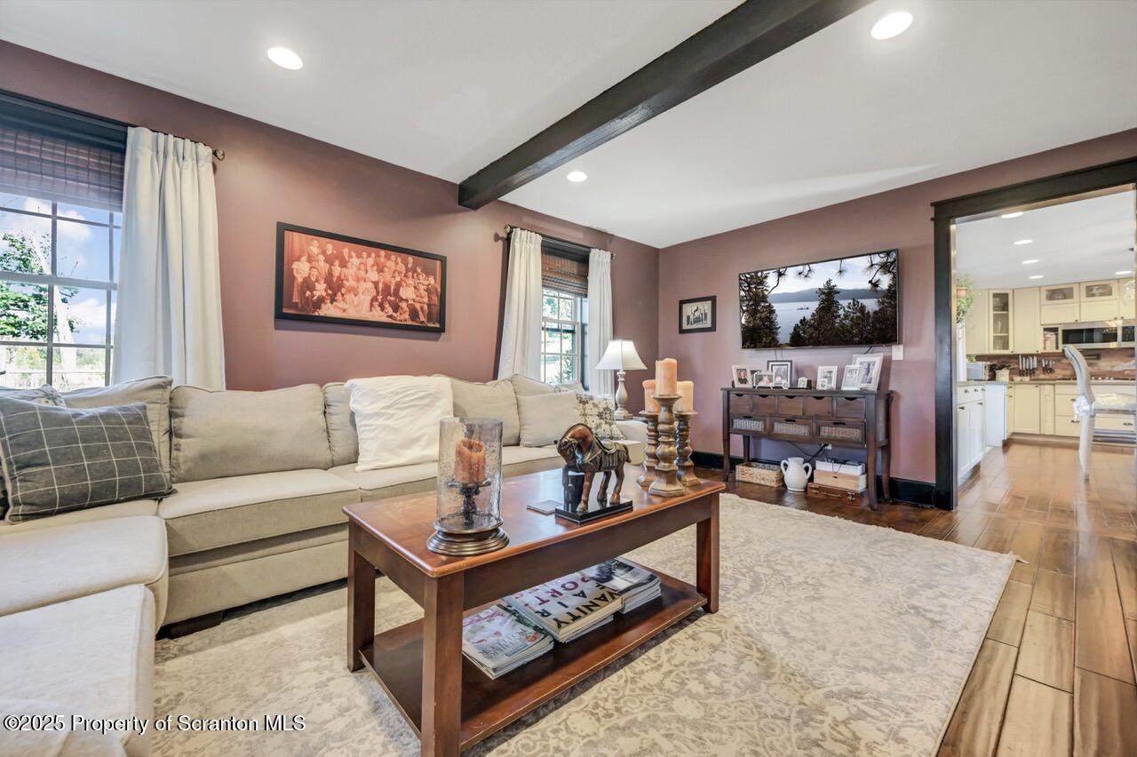 2225 Cherry Hill Road Clarks Summit, PA 18411 - Photo 28 of 81 a living room with furniture a flat screen tv and a fireplace