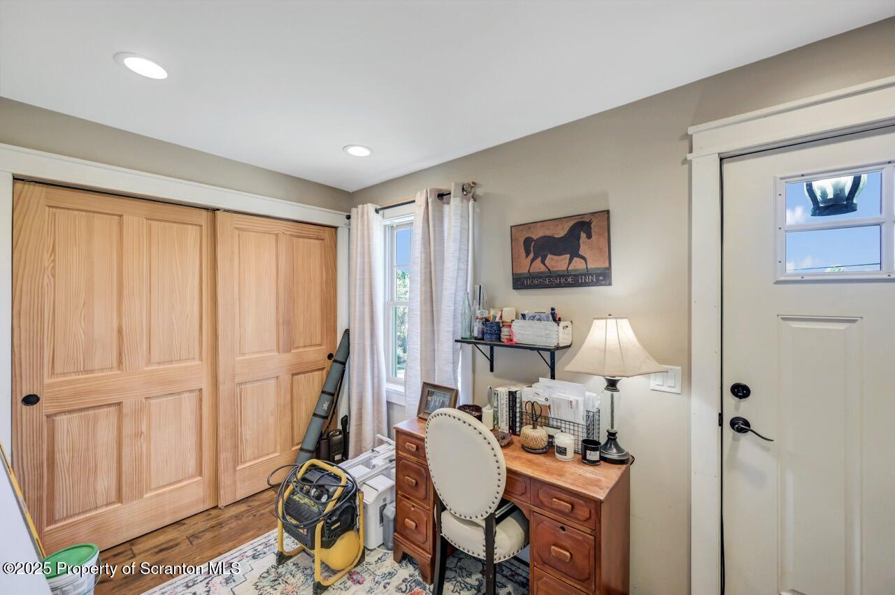 2225 Cherry Hill Road Clarks Summit, PA 18411 - Photo 34 of 81 a room with furniture and a gate