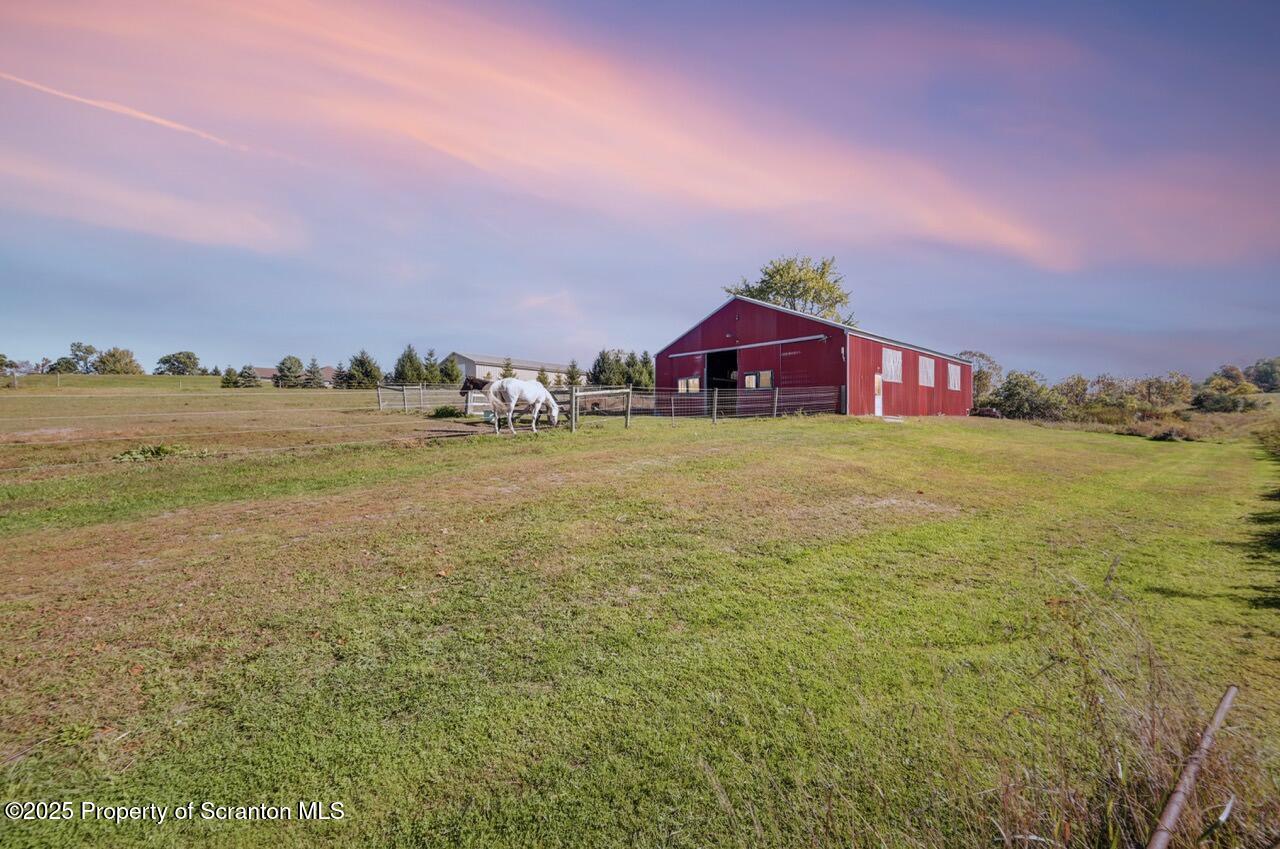 2225 Cherry Hill Road Clarks Summit, PA 18411 - Photo 4 of 81 a view of a big room with an ocean and trees in the background
