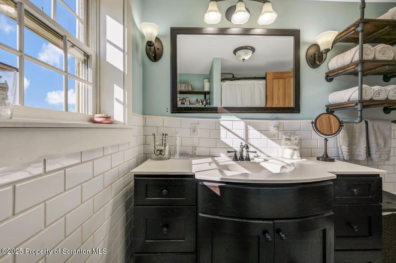 2225 Cherry Hill Road Clarks Summit, PA 18411 - Photo 41 of 81 a bathroom with a sink and a mirror