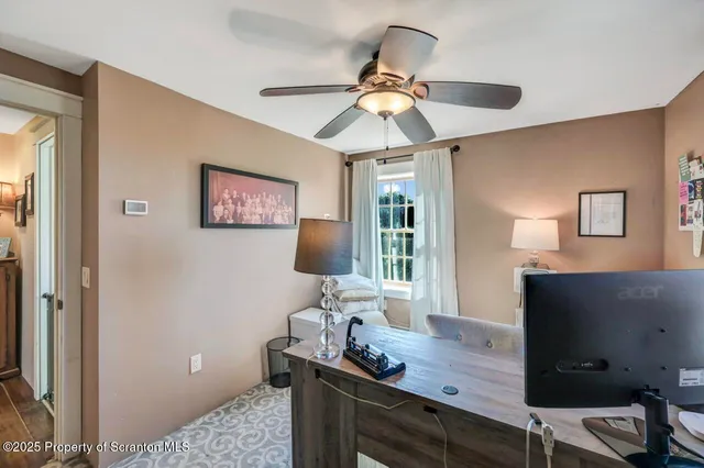 a aerial view of a house with a yard