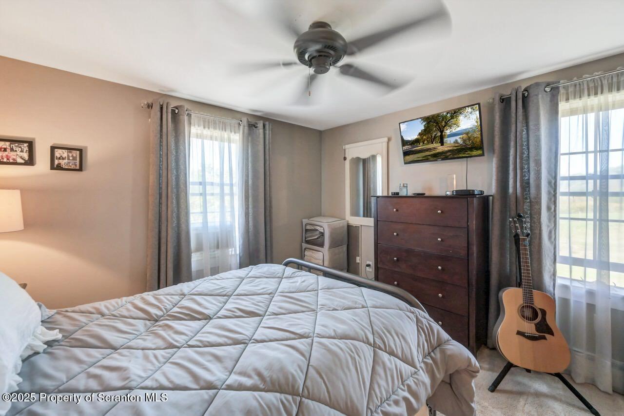 2225 Cherry Hill Road Clarks Summit, PA 18411 - Photo 46 of 81 a bedroom with a bed and wooden floor