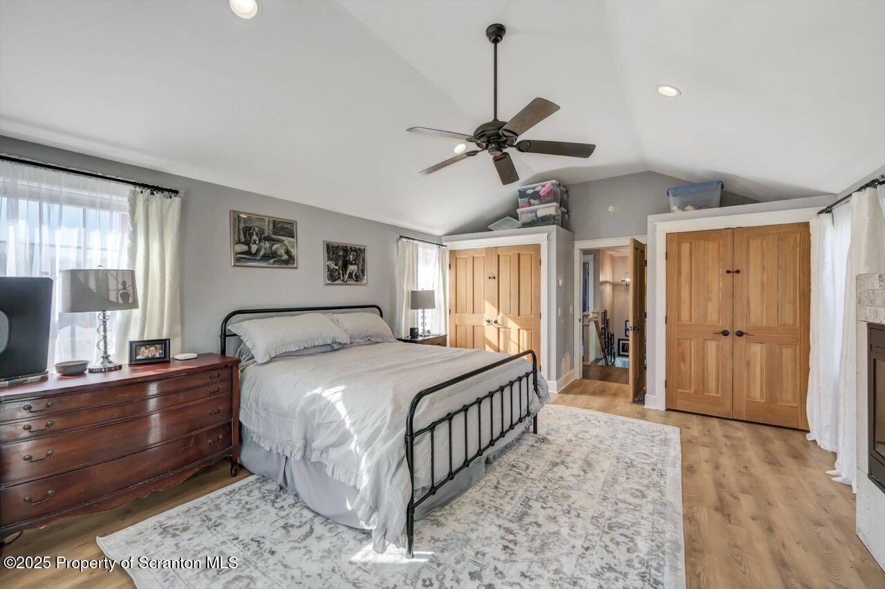 2225 Cherry Hill Road Clarks Summit, PA 18411 - Photo 52 of 81 a bedroom with a bed chandelier and a window