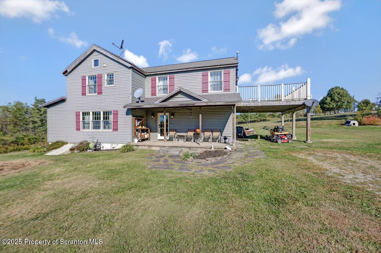 2225 Cherry Hill Road Clarks Summit, PA 18411 - Photo 63 of 81 a view of a house with a yard table and chairs