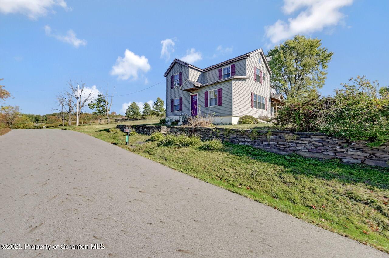 2225 Cherry Hill Road Clarks Summit, PA 18411 - Photo 66 of 81 a front view of a house with a yard and garage