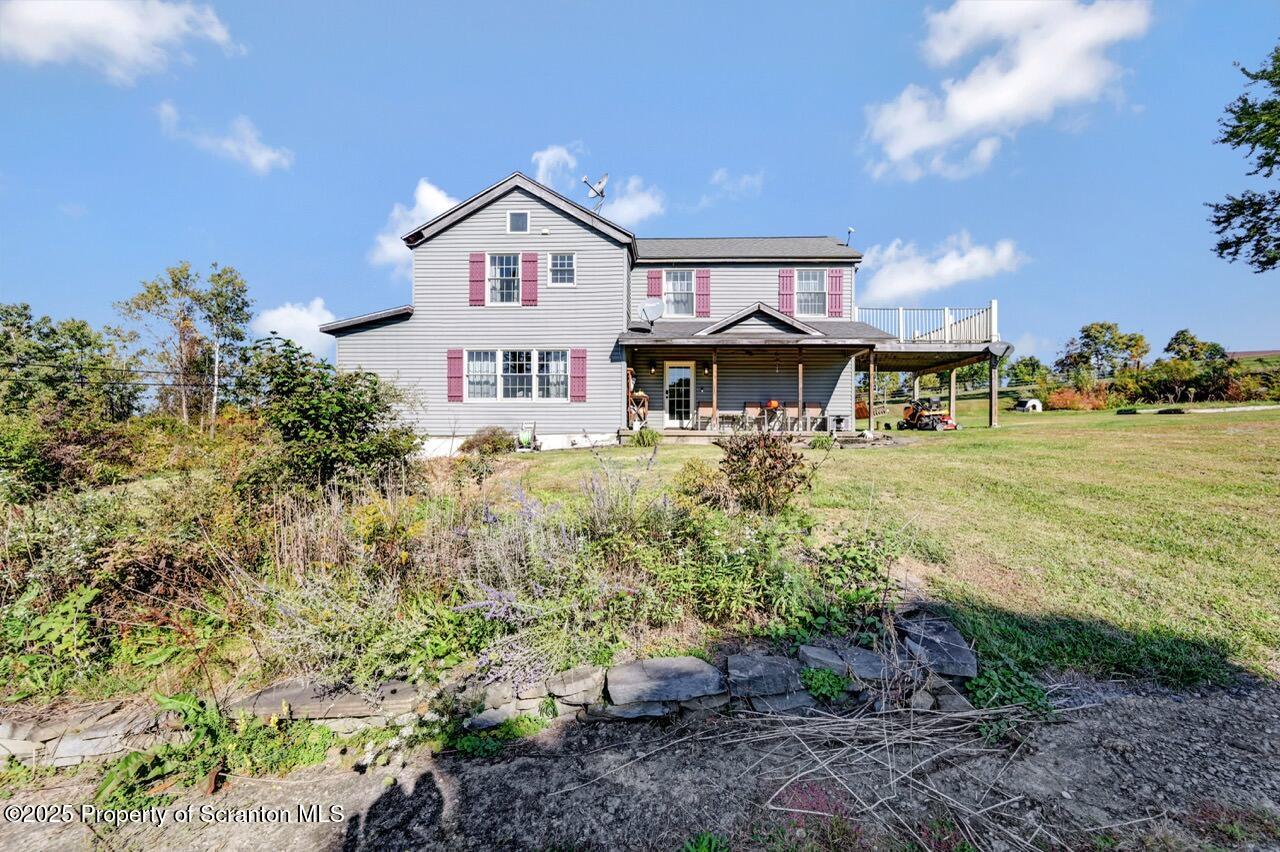 2225 Cherry Hill Road Clarks Summit, PA 18411 - Photo 7 of 81 a front view of a house with garden