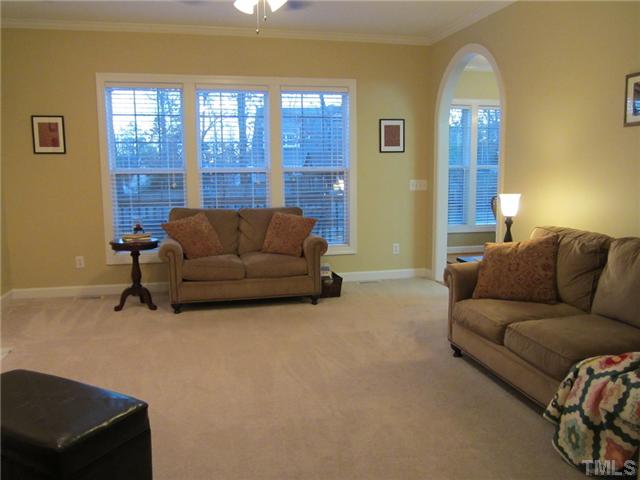6405 Nowell Pointe Drive Raleigh, NC 27607 - Photo 4 of 19 Beautiful well lit family room with archway to the kitchen.