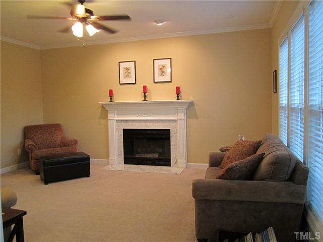 6405 Nowell Pointe Drive Raleigh, NC 27607 - Photo 5 of 19 Marble surround gas firplace in the living room.