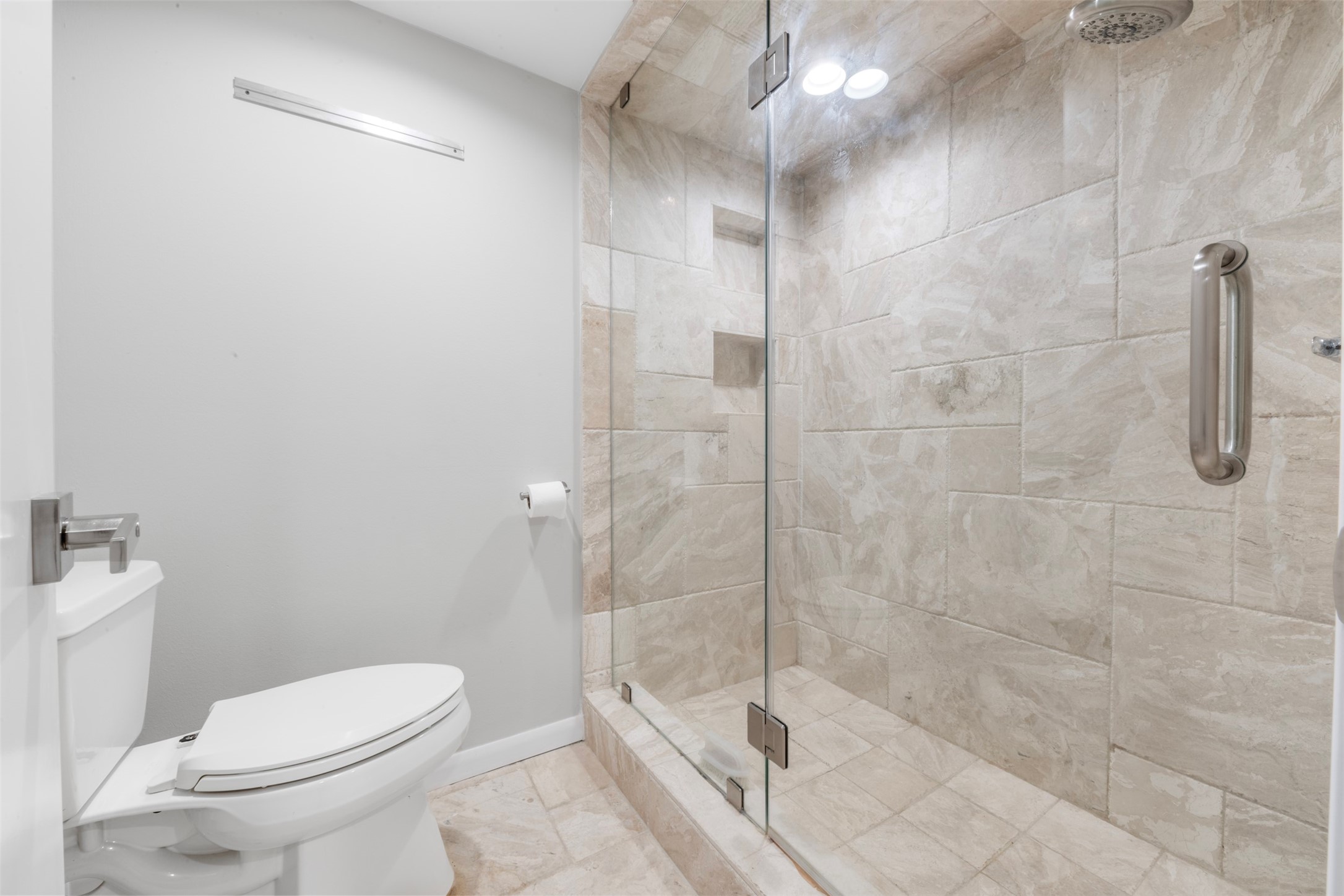 3141 Bissonnet Street Houston, TX 77005 - Photo 11 of 45 a bathroom with a shower a toilet and sink